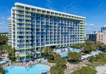 Stay Longer & Save at Coral Beach Resort! Photo