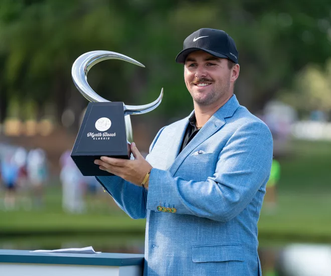 Chris Gotterup, 2024 Myrtle Beach Classic tournament champion holding trophy