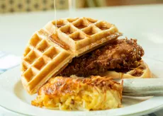 Chicken and Waffles from Croissants with syrup drizzled on top
